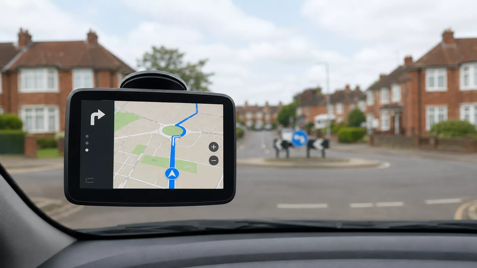 Sat-nav mounted on a windscreen showing a practice route on a UK street